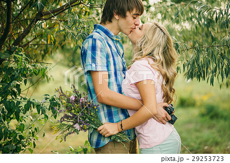 teenage couple kissing and embracing teenage couple kissing and embracing 29253723