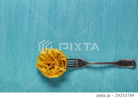 Concept of food, pasta on a blue background Concept of food, pasta on a blue background 29253784