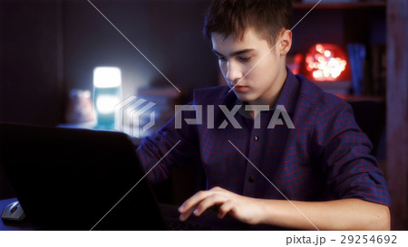 young boy with the laptop works 29254692
