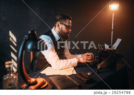Literature author in glasses typing on typewriter Literature author in glasses typing on typewriter 29254788