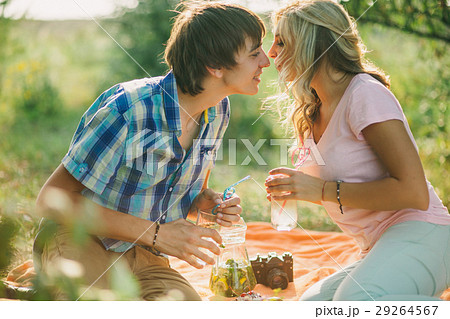 teenage couple kissing on picnic 29264567