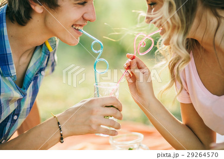 teenage couple smiling with cocktail teenage couple smiling with cocktail 29264570