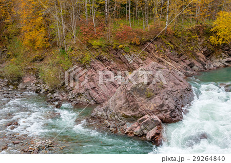 Rock in stream flow of mountains river fall season Rock in stream flow of mountains river fall season 29264840