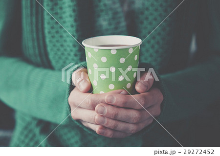 hands holding paper cup with take-out coffee 29272452