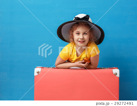 Child blonde girl with pink vintage suitcase ready 29272491