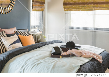 set of pillows on bed with blanket 29274737