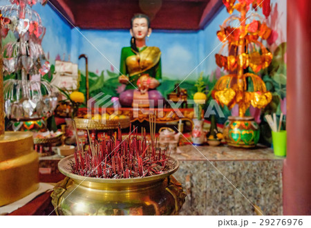 Burning red incense sticks in small Chinese temple 29276976