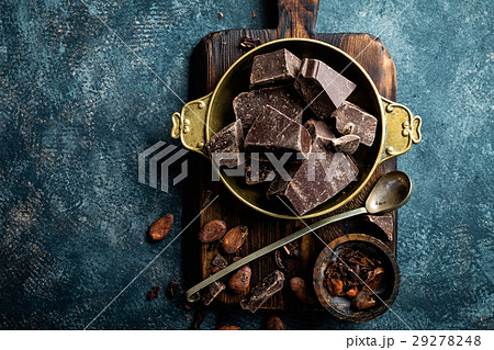 Dark chocolate pieces crushed and cocoa beans 29278248