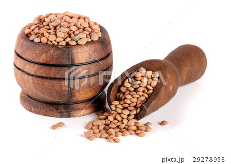 Lentils in a wooden bowl with a scoop isolated on Lentils in a wooden bowl with a scoop isolated on 29278953