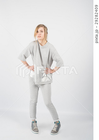 beautiful girl wearing grey clothes and sneakers 29282409