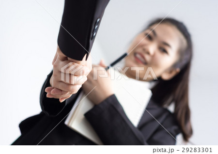 Businesswoman Shaking Hands In Office 29283301
