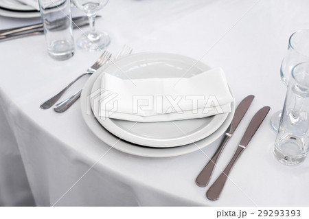 Empty plate on the table, cutlery set. Table Empty plate on the table, cutlery set. Table 29293393