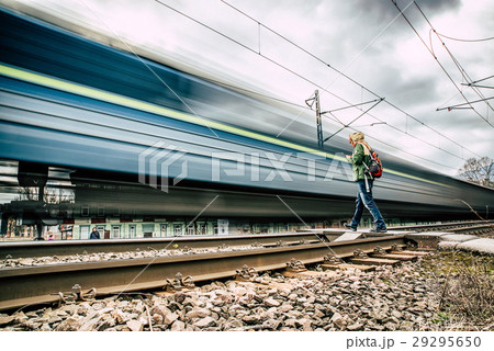 Fast train and man on rails 29295650