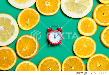 photo of cute alarm clock near dried orange slices 29295777