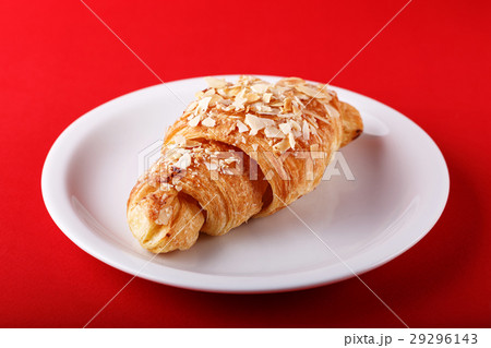 breakfast croissant on a red background breakfast croissant on a red background 29296143