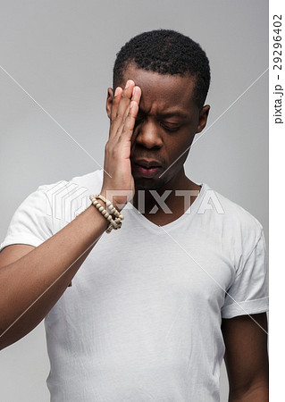 Worried afroamerican guy feels sad and troubled 29296402