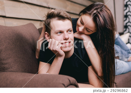 happy couple lying in bed at hotel 29296862