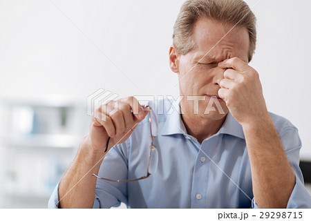 Disappointed male person touching his bridge of Disappointed male person touching his bridge of 29298715