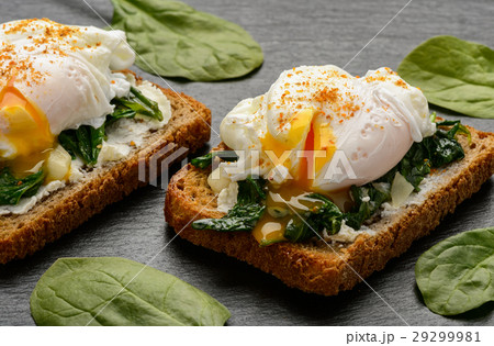 Sandwich with creme cheese, spinach and egg. Sandwich with creme cheese, spinach and egg. 29299981