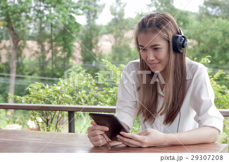 Asian woman listening music Asian woman listening music 29307208