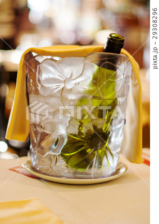 Chilled bottle of wine in a bucket with ice 29308296