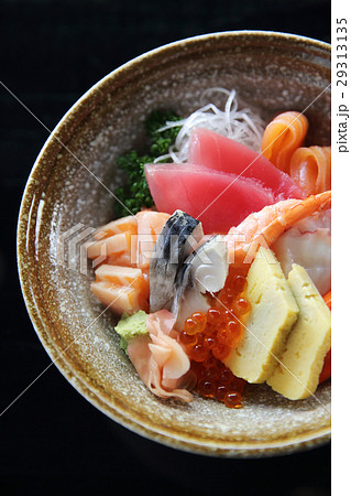 Sushi don , raw salmon tuna octopus and egg on rice Sushi don , raw salmon tuna octopus and egg on rice 29313135