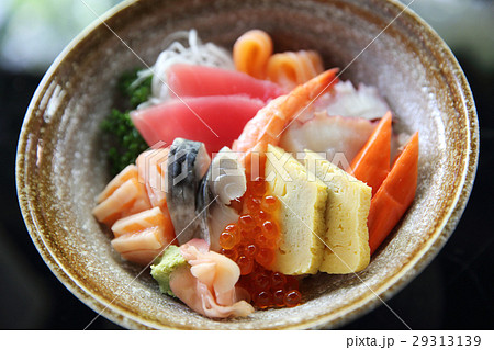 Sushi don , raw salmon tuna octopus and egg on rice Sushi don , raw salmon tuna octopus and egg on rice 29313139