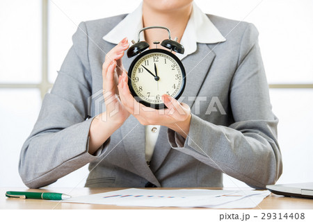business woman holding clock business woman holding clock 29314408