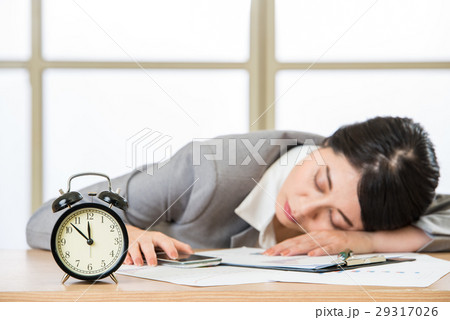 Tired woman are sleeping and holding smart phone 29317026