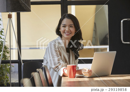 The woman is working enjoy the morning indoors 29319858