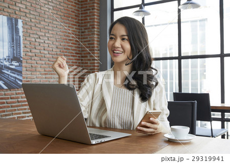 The woman is listening to other's presentation and looks very happy 29319941