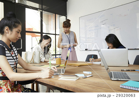 Young colleagues are discussing new business ideas in office. 29320063