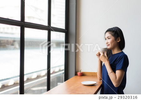 the businesswoman is drinking coffee the businesswoman is drinking coffee 29320316