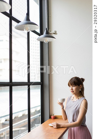 the businesswoman is drinking coffee 29320317
