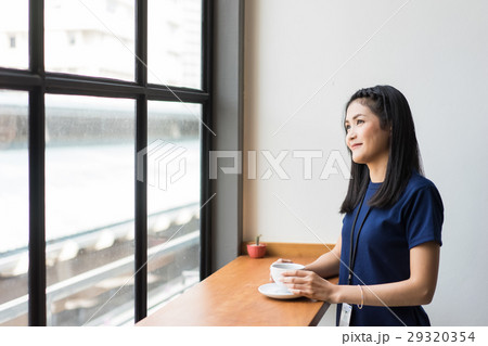 the businesswoman is drinking coffee 29320354