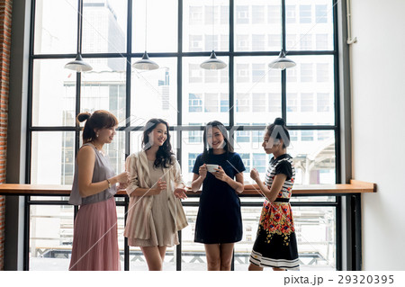 businesswomen are chatting in the pantry. businesswomen are chatting in the pantry. 29320395