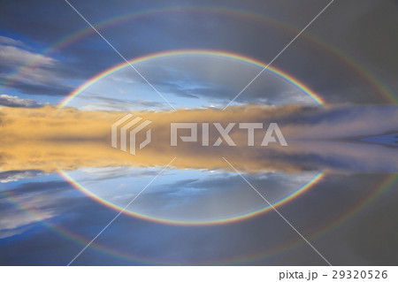 Reflection of a rainbow in calm water Reflection of a rainbow in calm water 29320526