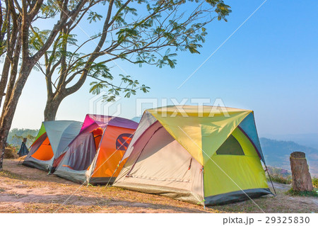 Three Tents Camping On Hill With Blue Clear Sky Three Tents Camping On Hill With Blue Clear Sky 29325830