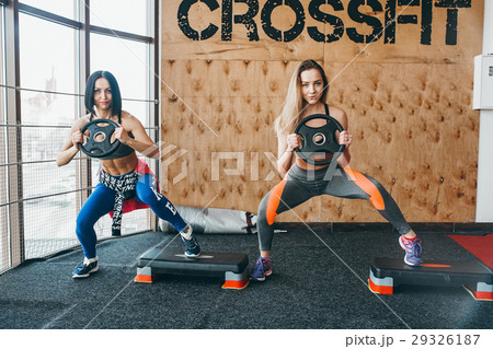 Two beautiful girls together in a fitness room 29326187