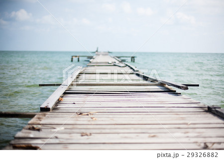 Wooden pier on the sea background Wooden pier on the sea background 29326882