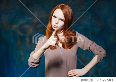 Strict red haired girl shows finger with arms 29327504