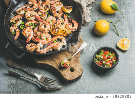 Grilled tiger prawns in pan with lemon, leek 29329805
