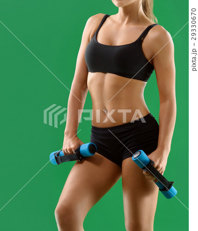Young attractive woman with dumbbells in her hands 29330670