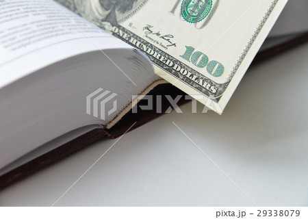Dollar bill used as a bookmark in a book Dollar bill used as a bookmark in a book 29338079