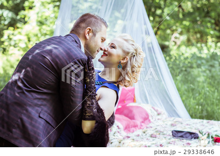 A couple by bed in meadow 29338646