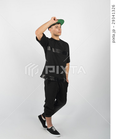 Young muscular man in black clothes and sneakers 29341326