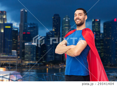 happy man in red superhero cape over night city 29341404