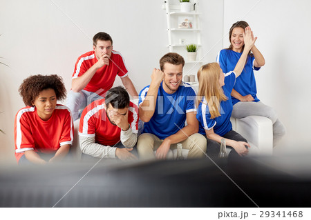 friends or football fans watching soccer at home friends or football fans watching soccer at home 29341468