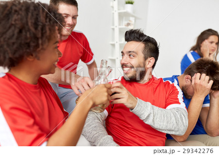happy football fans or friends with beer at home happy football fans or friends with beer at home 29342276