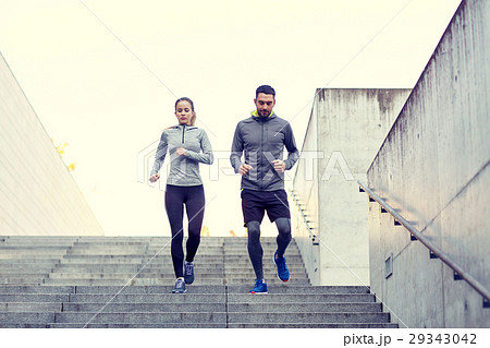 couple walking downstairs on stadium 29343042